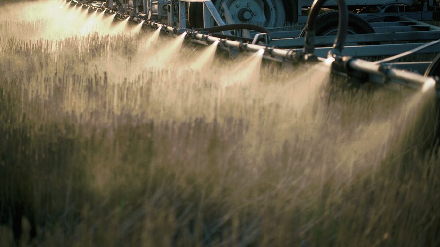 Detail of Nozzles Spraying Herbicide on Field