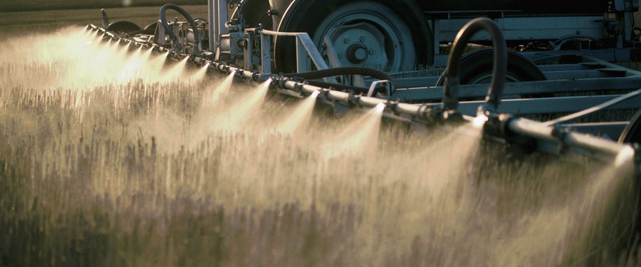 Detail of Nozzles Spraying Herbicide on Field